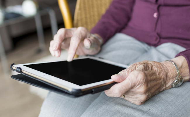 Elderly person using Ipad